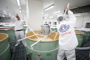 Workers brewing sake